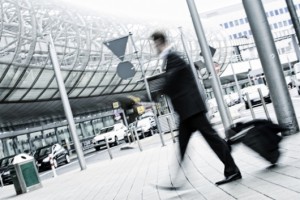 businessman with trolley at the airport, motion blurred